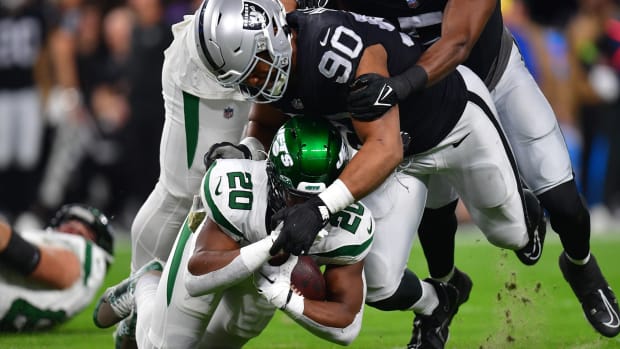 Nov 12, 2023; Paradise, Nevada, USA; Las Vegas Raiders defensive tackle Jerry Tillery (90) brings down New York Jets running back Breece Hall (20) during the first half at Allegiant Stadium.